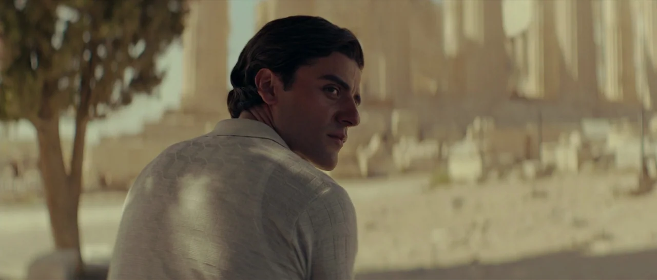 The Two Faces of January (2014) movie still: medium — An outdoor archaeological site features ancient columns and dry, sandy terrain under bright…