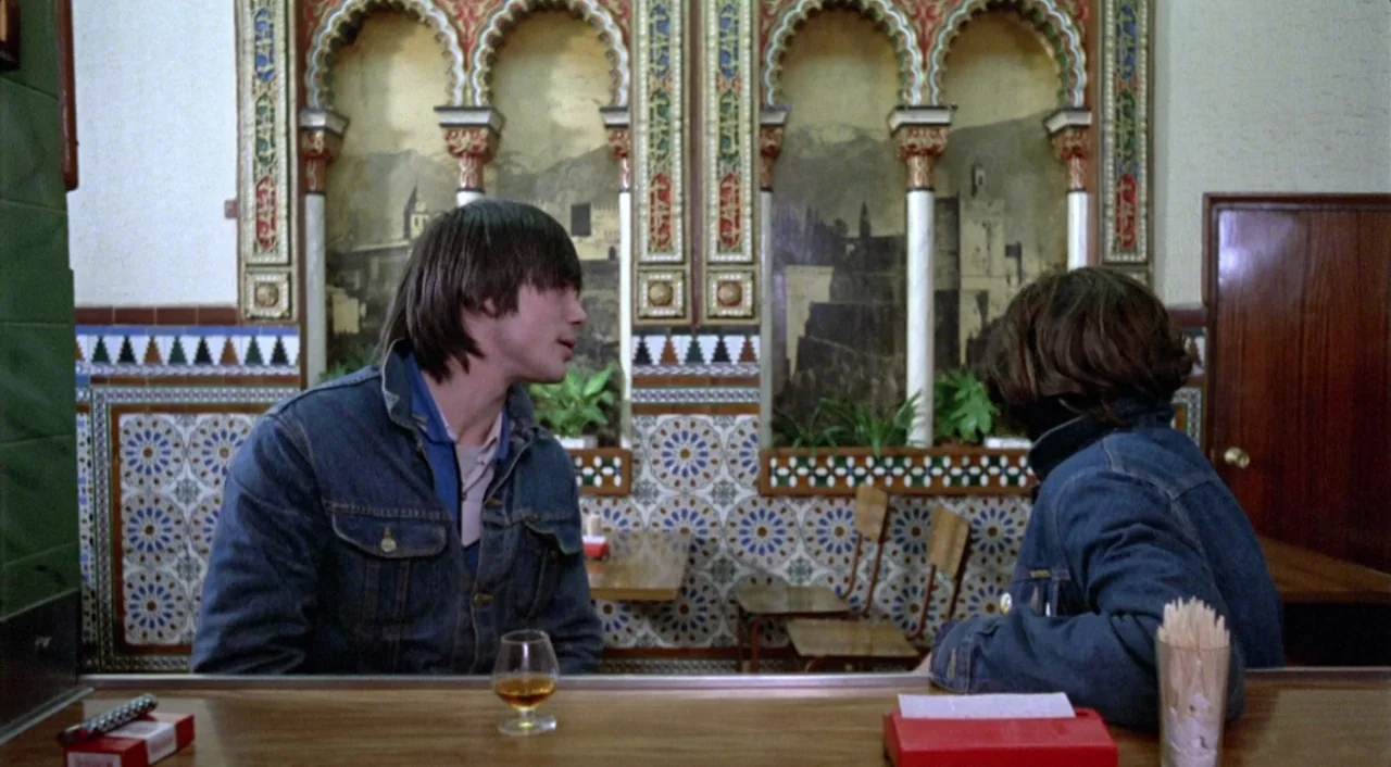 What Have I Done To Deserve This? (1984) movie still: medium — An interior bar with ornate, Moorish-style arched wall panels and decorative…