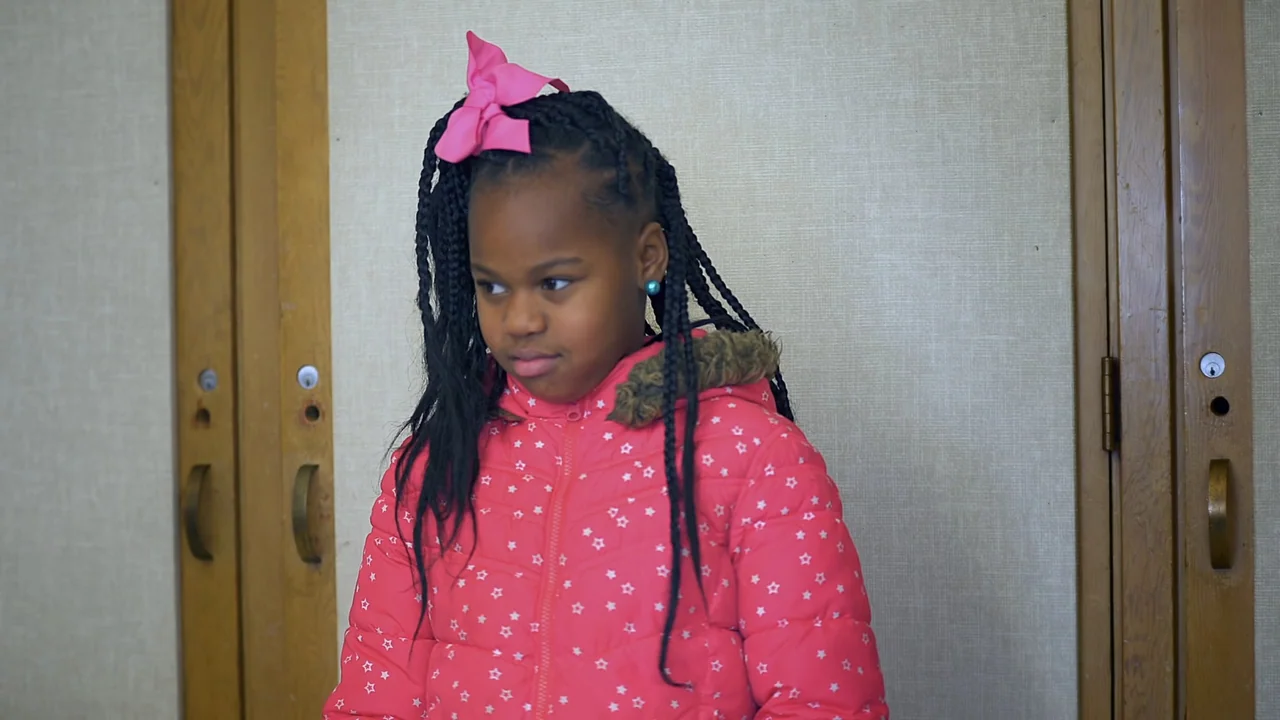 We Are the Dream: The Kids of the Oakland MLK Oratorical Fest (2020) movie still: medium — An interior hallway features beige textured walls with…