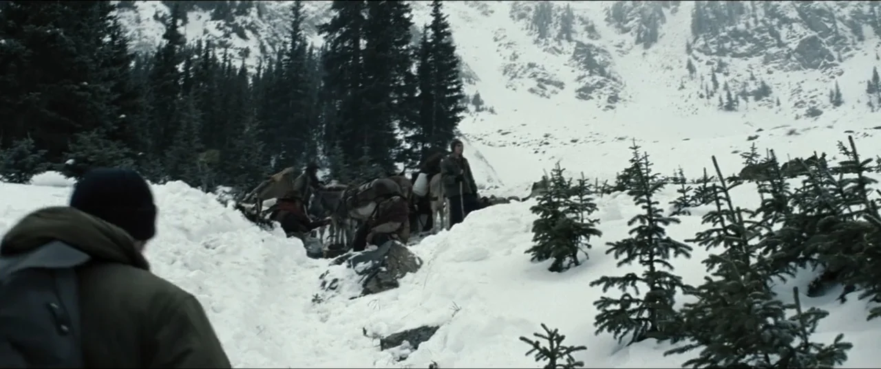 Batman v Superman: Dawn of Justice (2016) movie still: wide — A steep, snow-laden mountain pass is surrounded by dense evergreen trees and rocky…