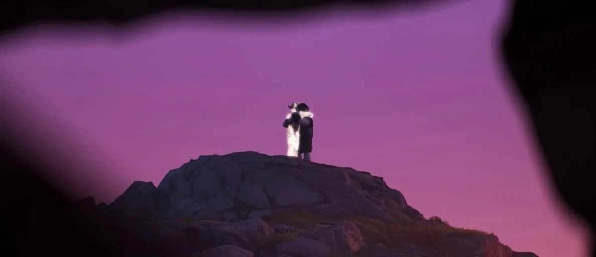 The Pixar Story (2007) movie still: wide — A rocky mountain peak stands against a clear, deep purple sunset sky. Two figures stand close together on…