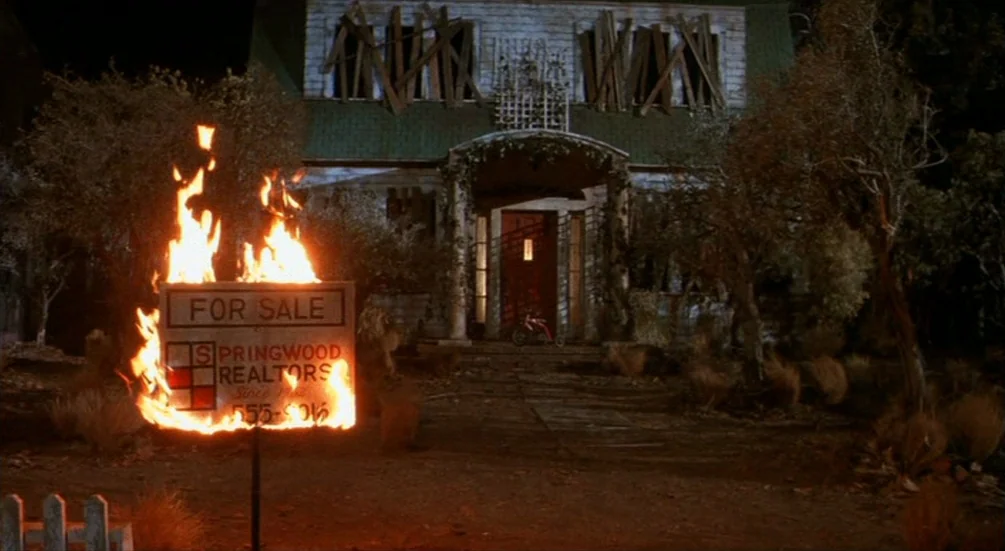 Freddy’s Dead: The Final Nightmare (1991) movie still: wide — A two-story suburban house sits dark at night with boards over the upstairs windows. A…