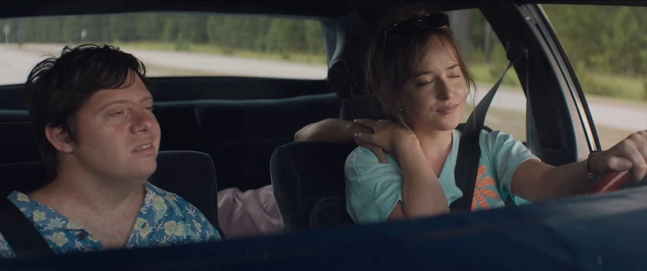 The Peanut Butter Falcon (2019) movie still: medium — The interior of a moving car shows two people traveling on a rural road. A man sits in the…