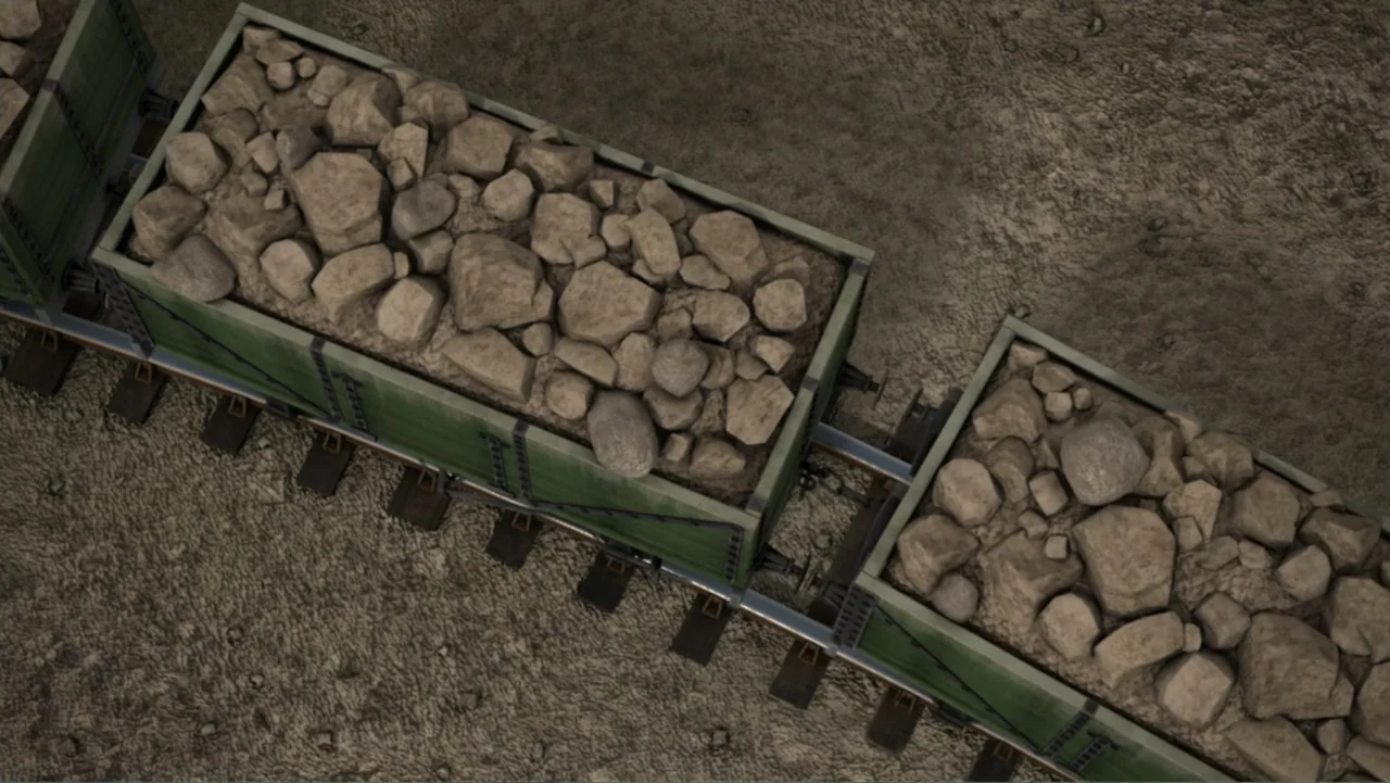 Thomas & Friends: Tale of the Brave (2014) movie still: wide — A top-down view shows multiple train cars loaded with piles of gray rocks. The green…