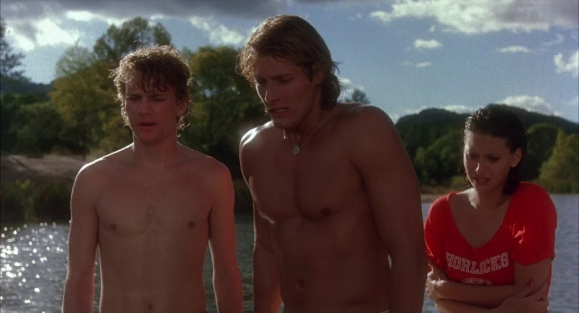Creepshow 2 (1987) movie still: medium — Two men and a woman stand by the edge of a water body. The individuals look down at an unseen point near…