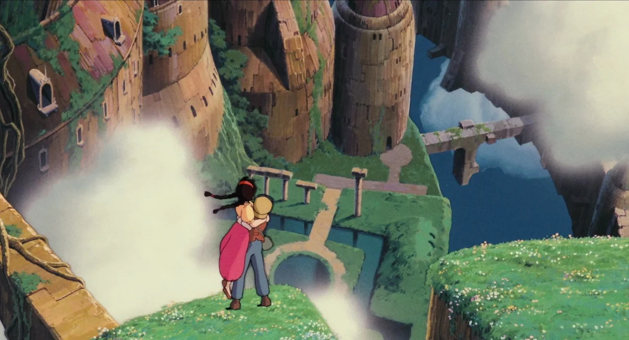 Castle in the Sky (1986) movie still: wide — A floating island features stone towers and overgrown gardens perched above a vast expanse. A girl hugs…