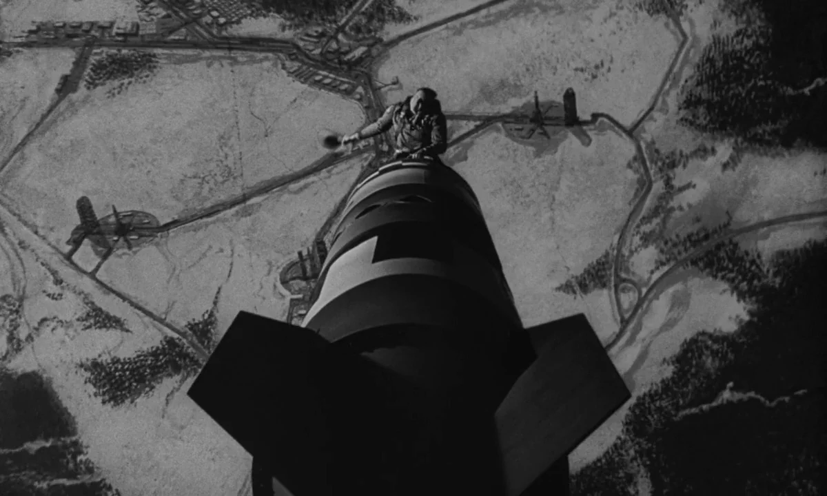Dr. Strangelove or: How I Learned to Stop Worrying and Love the Bomb (1964) movie still: wide — A man rides a falling missile over a vast map of…
