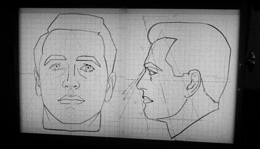 Seconds (1966) movie still: closeup — A light box displays technical pencil and ink sketches of a human head. One drawing shows a frontal view and…