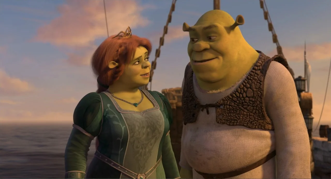 Shrek the Third (2007) movie still: medium — The deck of a ship is visible at sunset with the open ocean behind. A green ogre woman and a green ogre…