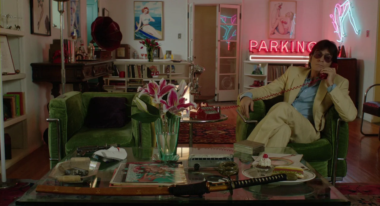 A Glimpse Inside The Mind Of Charles Swan III (2013) movie still: wide — An eclectic apartment interior features various kitsch decor, including…