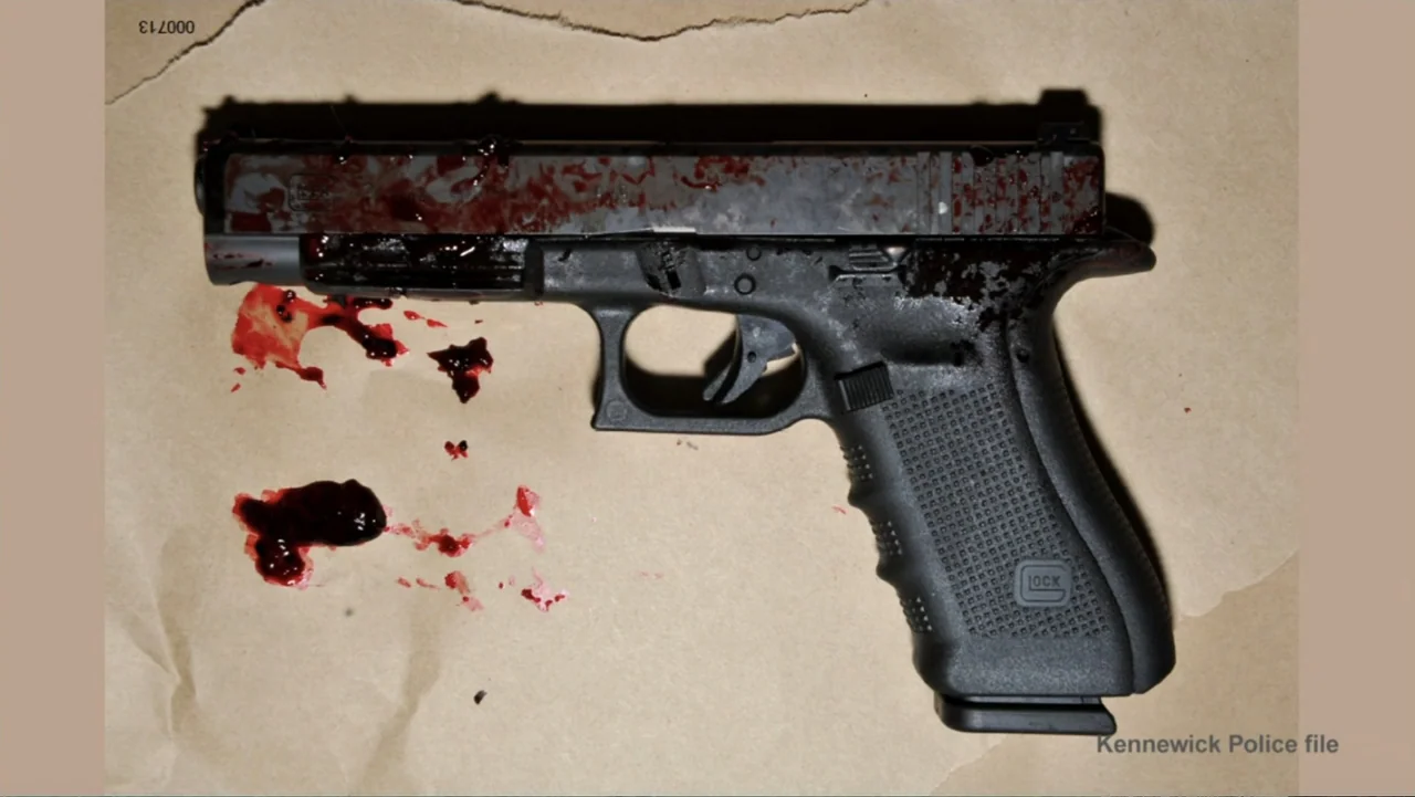 Requiem for the Dead: American Spring 2014 (2015) movie still: closeup — A semi-automatic pistol lies horizontally on a piece of textured light…