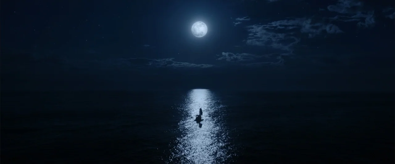 Jim Button and Luke the Engine Driver (2018) movie still: establishing — A vast, dark ocean expanse under a bright full moon at night. A small boat…