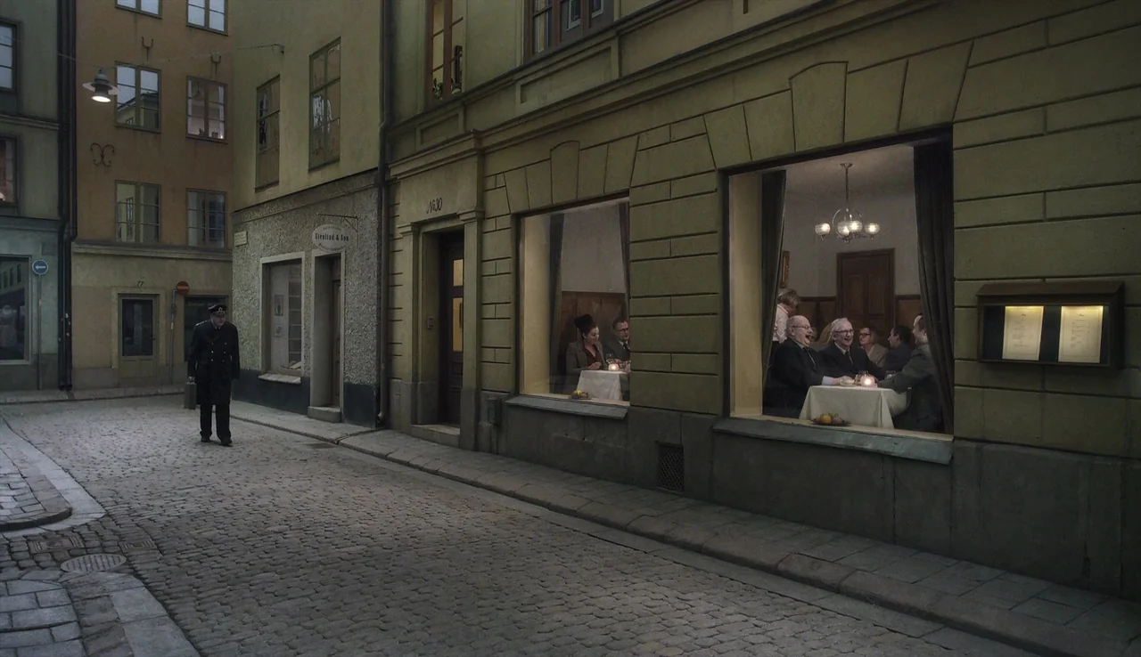 A Pigeon Sat on a Branch Reflecting on Existence (2014) movie still: wide — A narrow European-style cobblestone street at night is flanked by a…