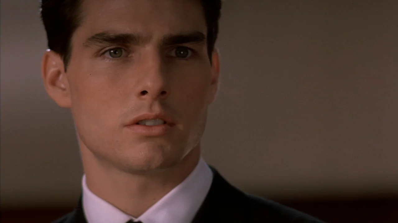 A Few Good Men (1992) movie still: closeup — An interior space features a man captured in a close-up against a muted background. A young man wearing…