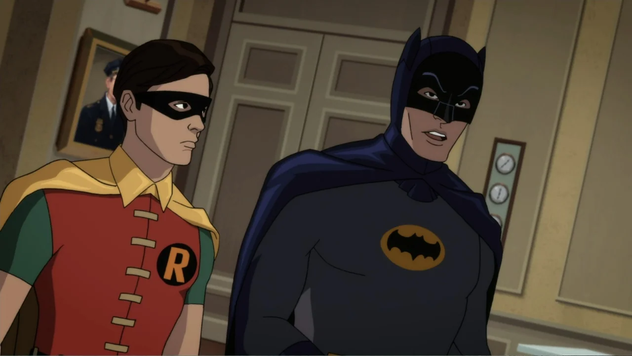 Batman: Return of the Caped Crusaders (2016) movie still: medium — An interior space features pale walls and a framed portrait of a uniformed man.…