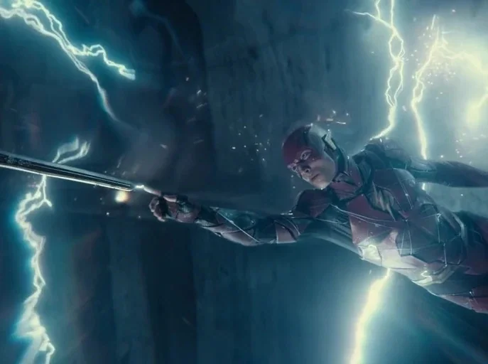 Zack Snyder's Justice League (2021) movie still: medium — A dark, blurred corridor is filled with jagged white electrical arcs and flying debris.…
