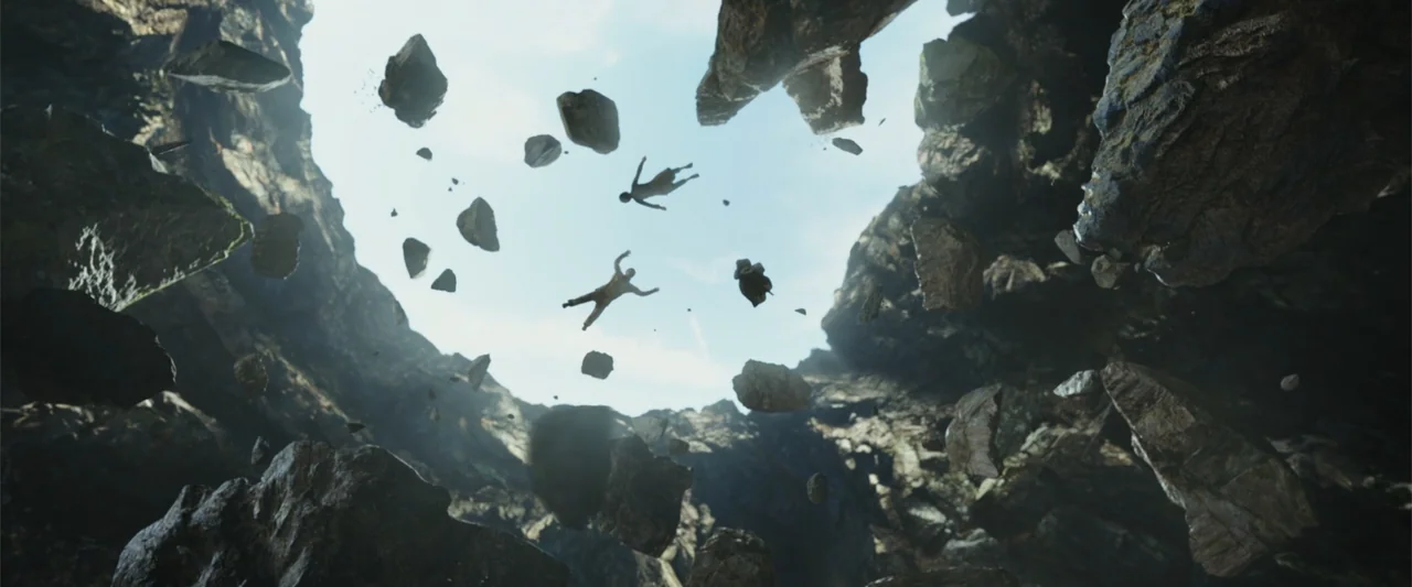 Along with the Gods: The Two Worlds (2017) movie still: wide — A deep rocky cavern with jagged walls opens to a bright sky above. Three figures…