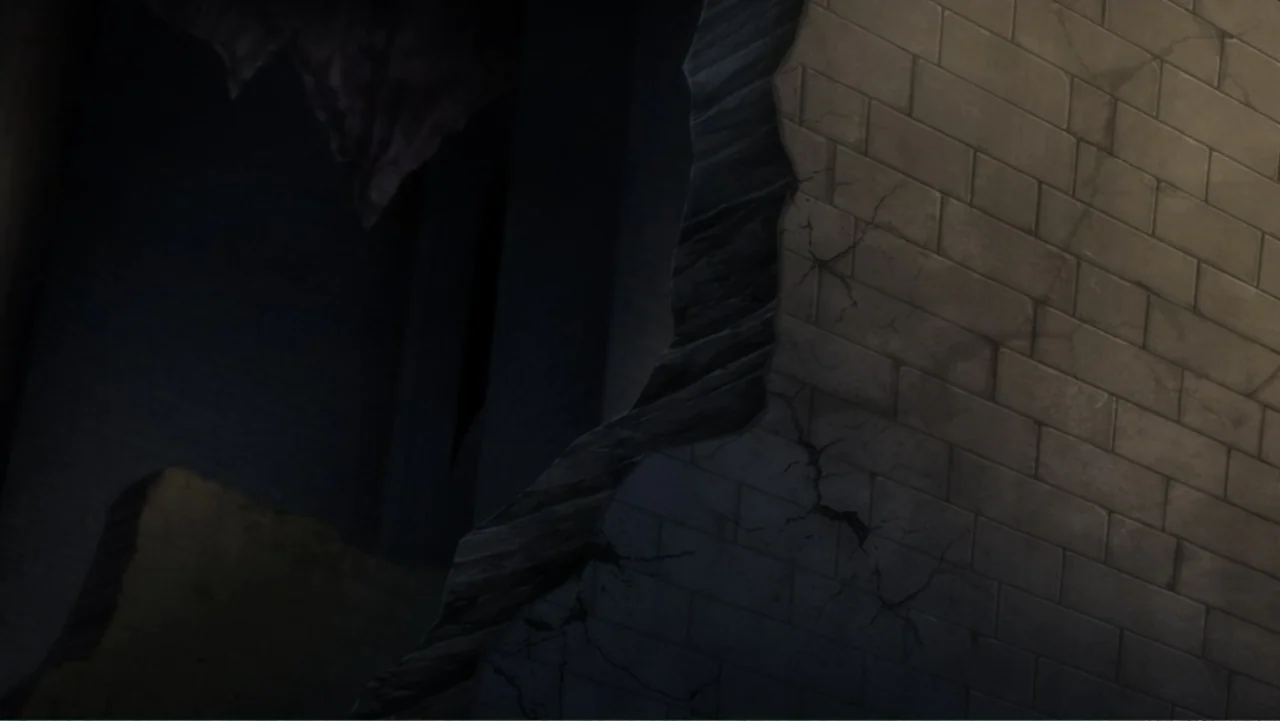 Batman: Assault on Arkham (2014) movie still: establishing — A stone brick wall with large cracks sits adjacent to a deep, dark abyss. The structure…