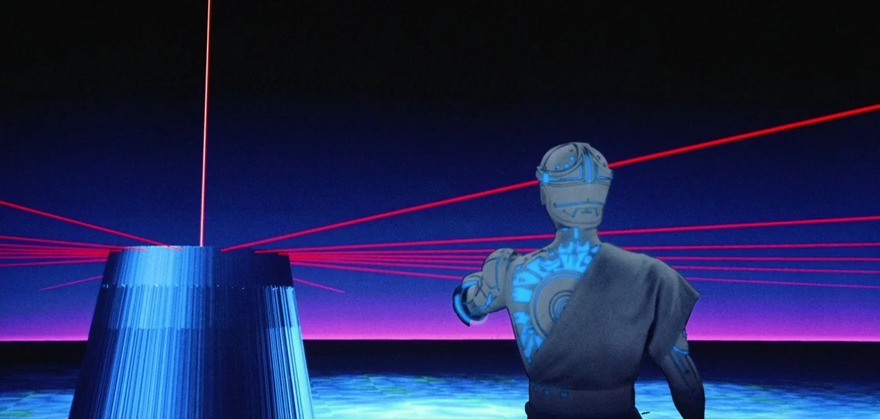 Tron (1982) movie still: medium — A dark digital landscape features a glowing blue pillar shooting red laser beams outward. A robotic figure in grey…