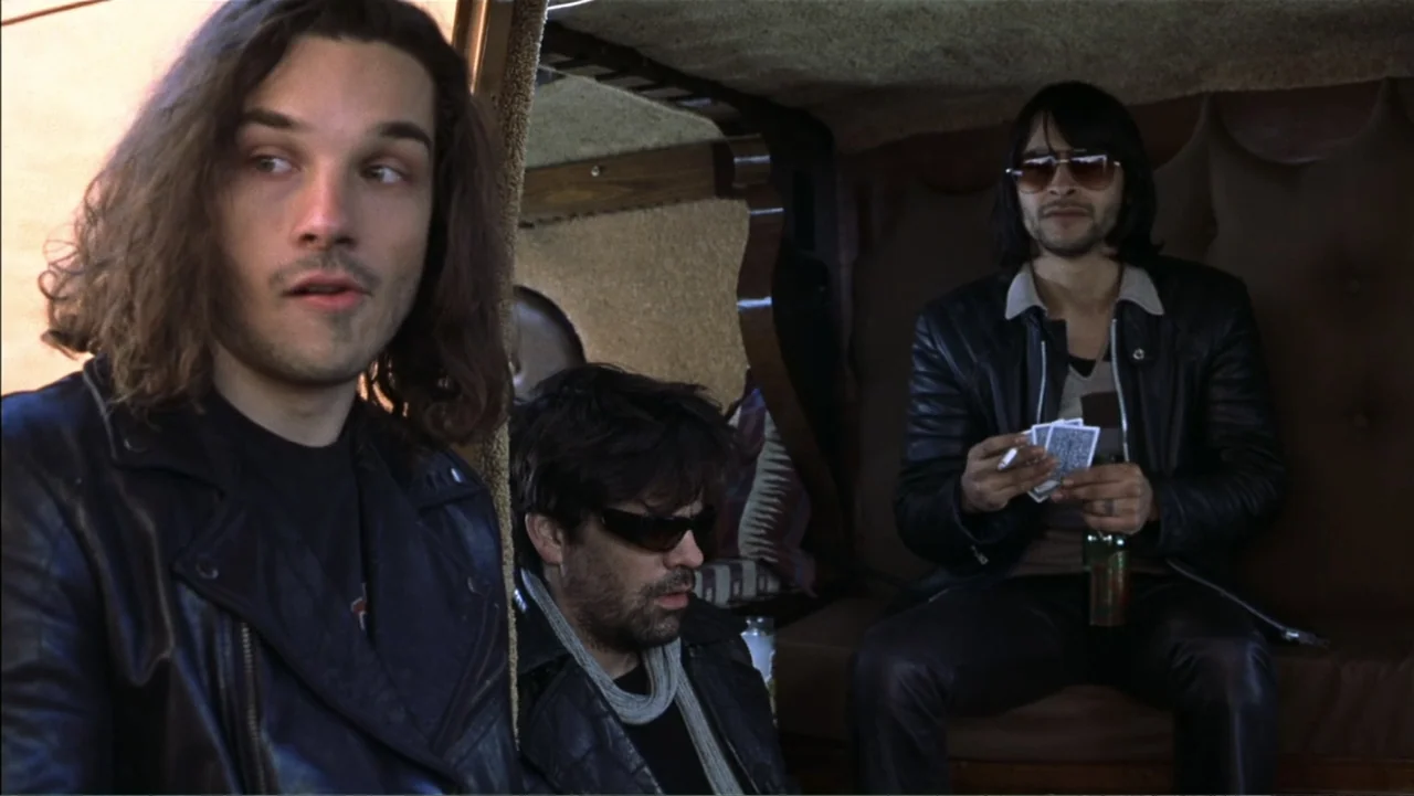 School of Rock (2003) movie still: medium — Three men are sitting together in the small interior of a customized van. They appear to be passing time…