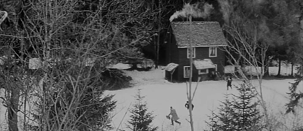 Shoot The Piano Player (Tirez Sur Le Pianiste) (1960) movie still: wide — A small wooden cabin stands in a clearing surrounded by leafless trees and…