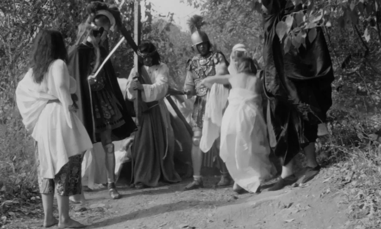 Multiple Maniacs (1970) movie still: fullbody — A group of people dressed in historical Roman and ancient period costumes stand outdoors. The…