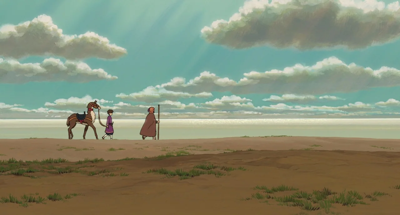 Tales From Earthsea (2006) movie still: wide — A vast sandy shoreline meets a calm sea under a sky filled with clouds. A young boy walking a pack…