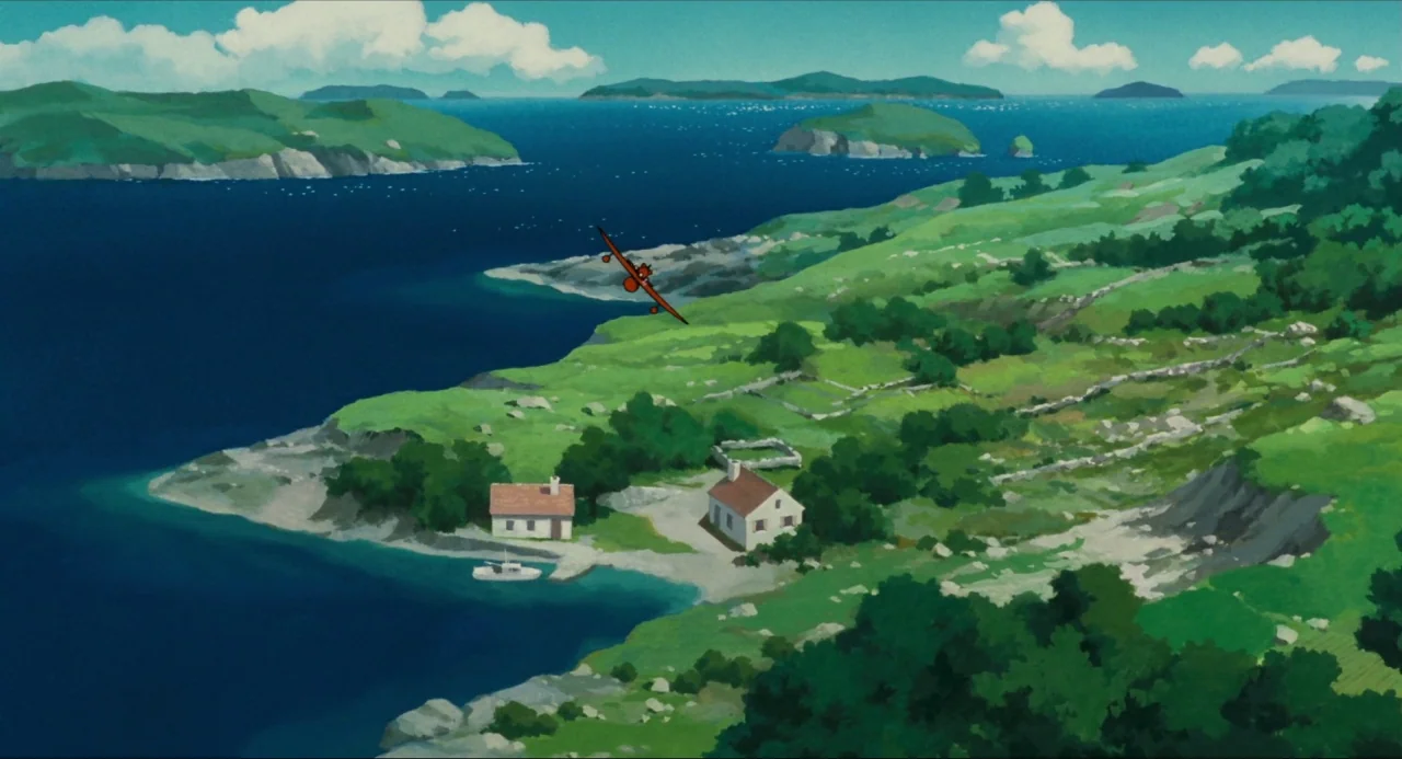 Porco Rosso (1992) movie still: establishing — A green coastal headland features stone walls, two small houses, and a moored boat. A small red…