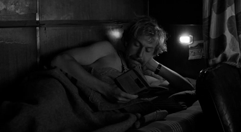 Kings of the Road (Im Lauf der Zeit) (1976) movie still: medium — A cramped train sleeper car interior features wooden paneling and patterned…