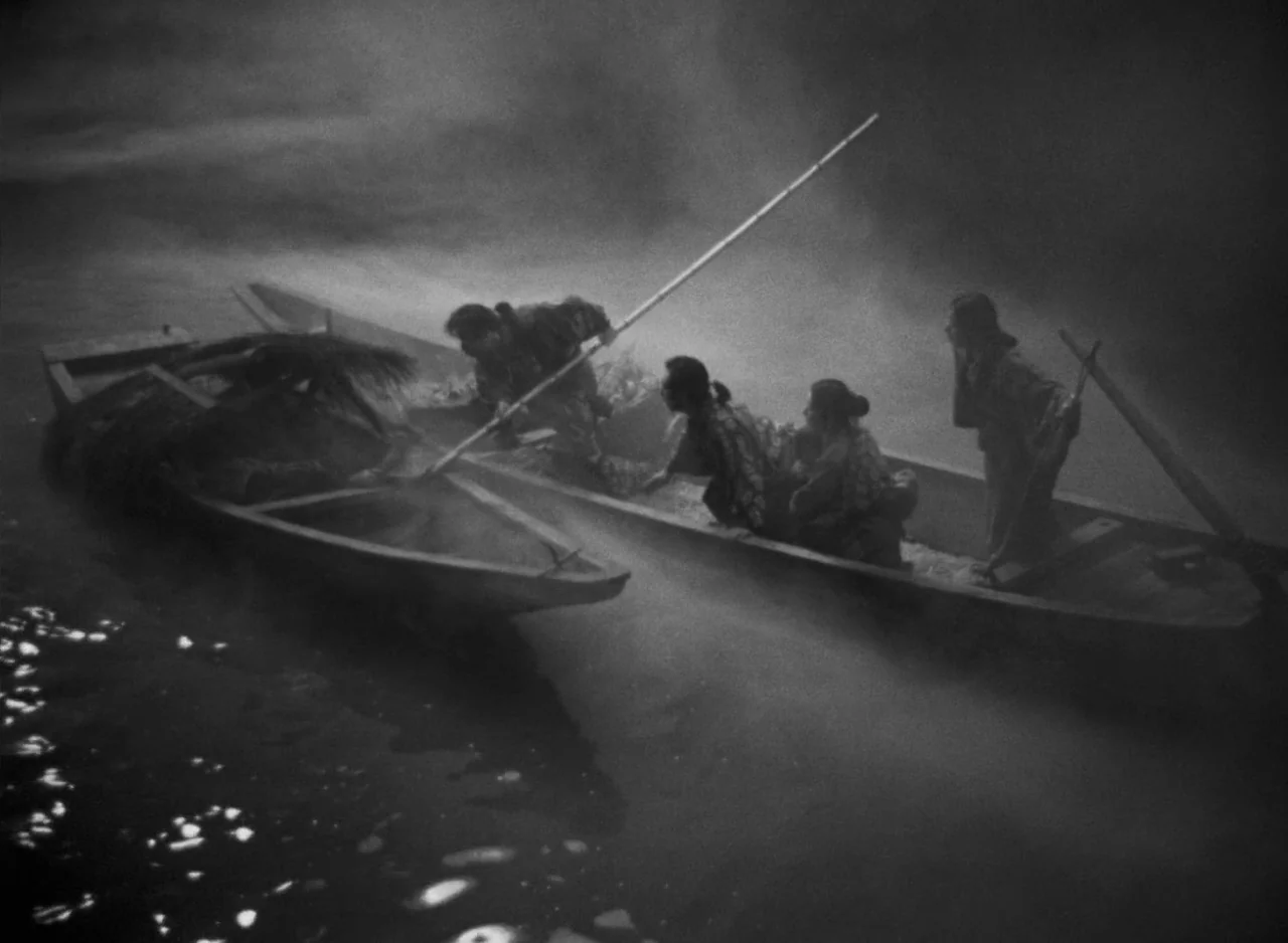 Ugetsu (1953) movie still: wide — Two wooden boats float on a dark, mist-covered river at night. Multiple figures in traditional clothing navigate…