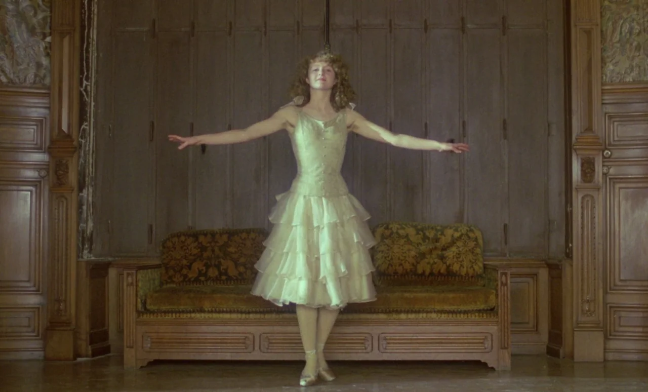 The Strange Case of Dr. Jekyll and Miss Osbourne (1981) movie still: fullbody — A wood-paneled room features a vintage sofa with patterned…
