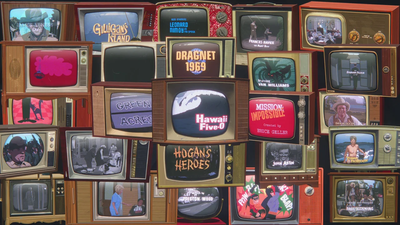 Apollo 10½: A Space Age Childhood (2022) movie still: establishing — A dense collage of vintage television sets fills the frame against a black…