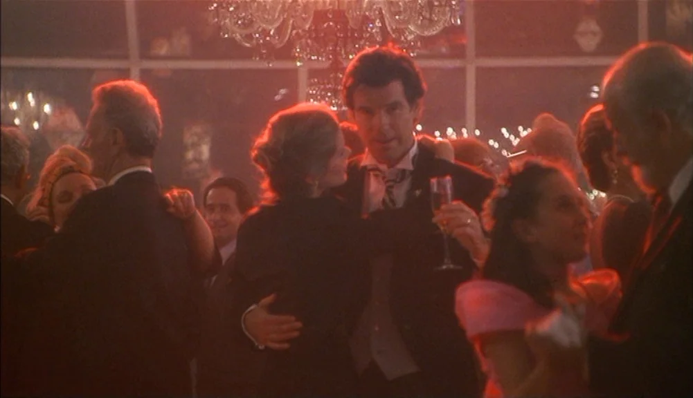 The Mirror Has Two Faces (1996) movie still: medium — A crowded formal event features a large crystal chandelier hanging from the ceiling above…