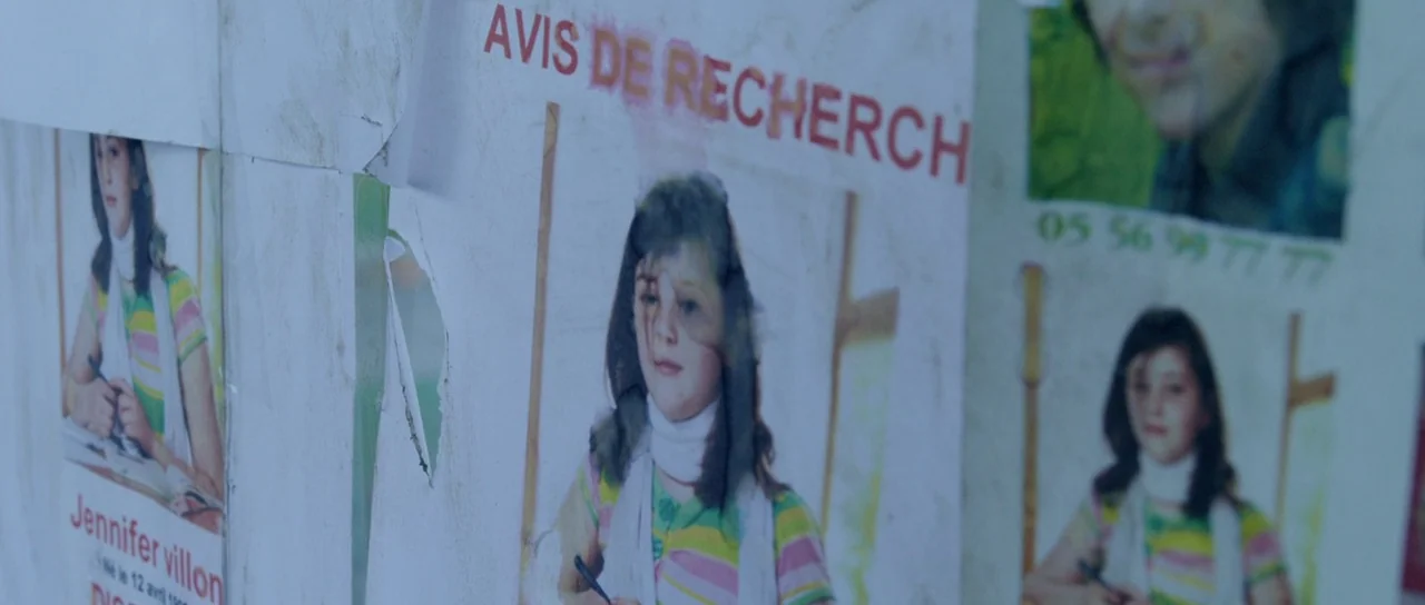Livid (2011) movie still: closeup — Multiple paper flyers titled AVIS DE RECHERCHE are layered on a vertical outdoor surface. Each flyer features a…