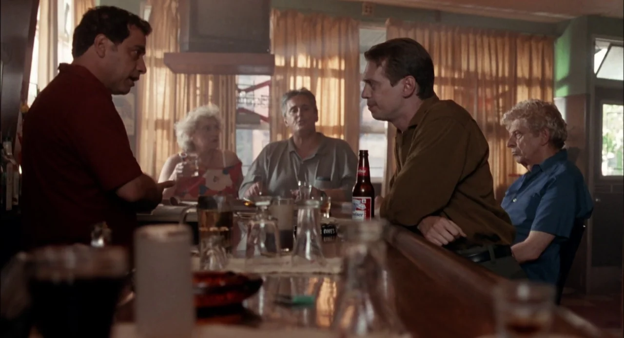 Trees Lounge (1996) movie still: medium — A dimly lit neighborhood watering hole features wood-paneled walls and sheer curtains over windows. A…