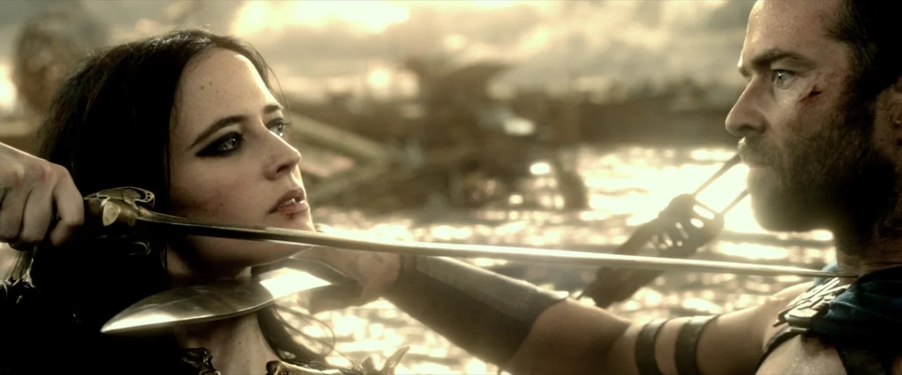 300: Rise of an Empire (2014) movie still: medium — An open, hazy battlefield under a bright, low-hanging sun with blurry wreckage in background. A…
