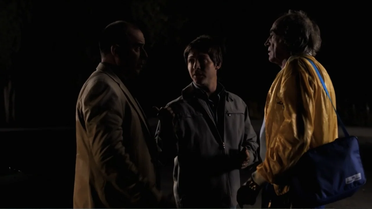 A Boyfriend for My Wife (2008) movie still: medium — Three men stand in a dark outdoor area at night during a conversation. The subjects are…