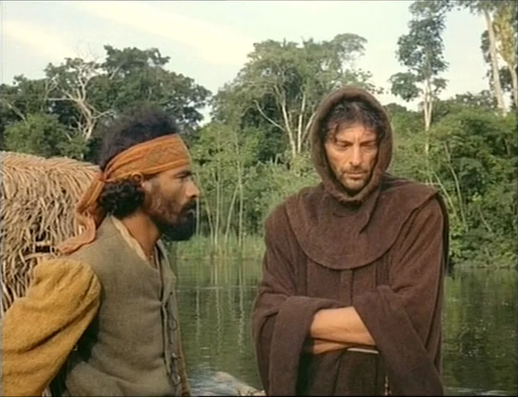 Aguirre, The Wrath Of God (Aguirre, der Zorn Gottes) (1972) movie still: medium — A riverbank scene featuring a dense tropical forest background…