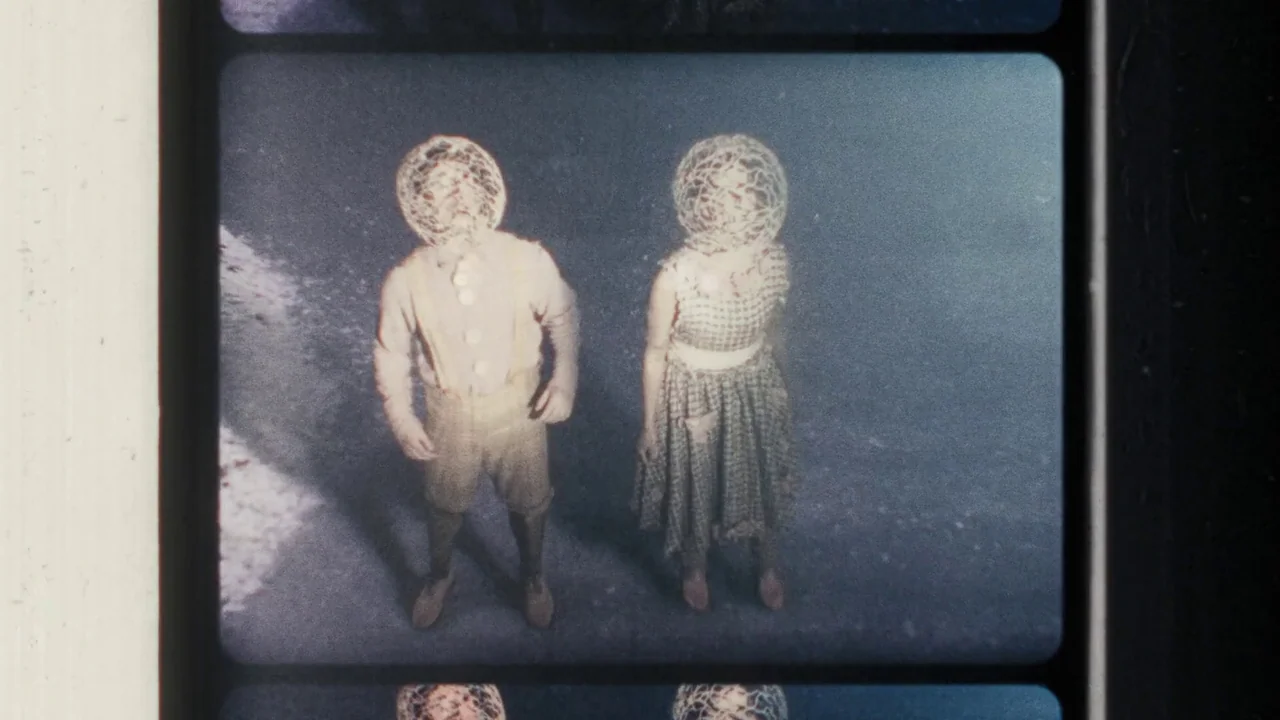 Once Within A Time (2022) movie still: fullbody — Two children stand on dark pavement during the night under dim lighting. Both figures have their…