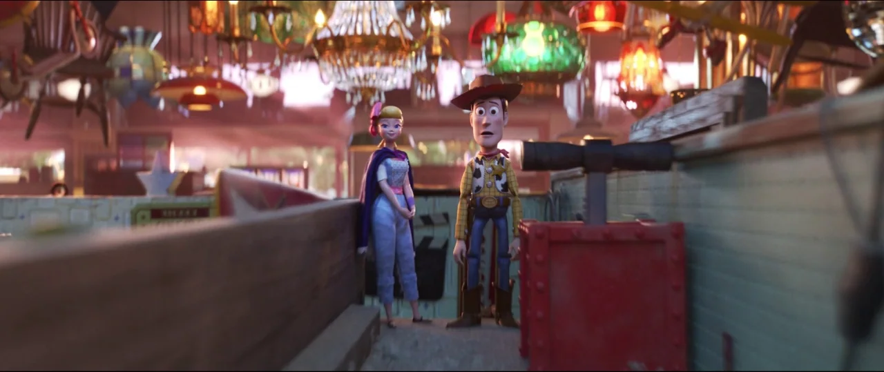 Toy Story 4 (2019) movie still: medium — An interior antique shop filled with numerous ornate chandeliers and various retro merchandise items. A toy…