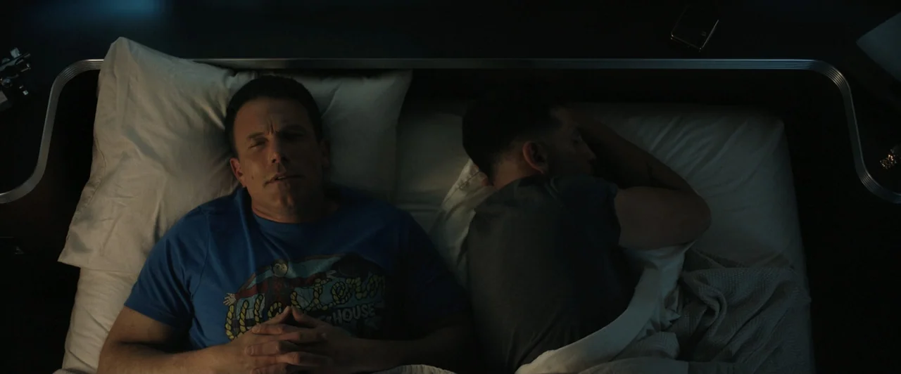True Account: Breaking the Truce (Yakuza Bloody Chronicles 2) (2007) movie still: medium — A dark, minimally furnished sleeping area features a bed…