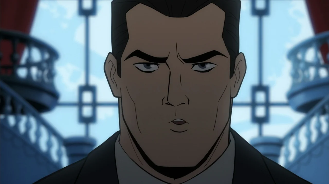 Batman: The Long Halloween, Part Two (2021) movie still: closeup — An interior space features stylized architectural balustrades blurred in the…