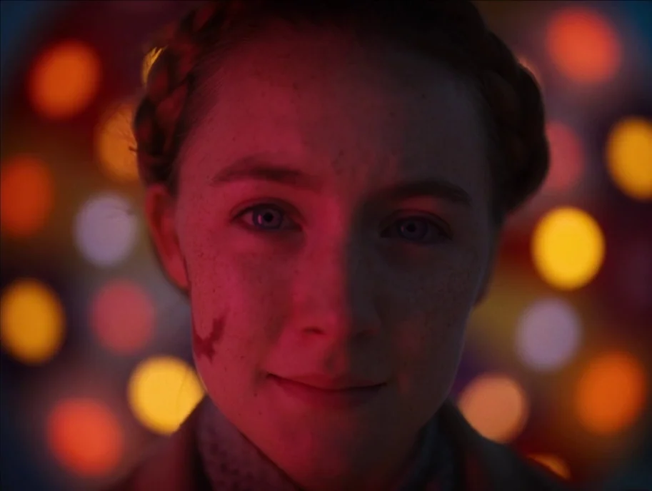 The Grand Budapest Hotel (2014) movie still: closeup — A dark space filled with out-of-focus, vibrant yellow and orange circular light patterns. A…