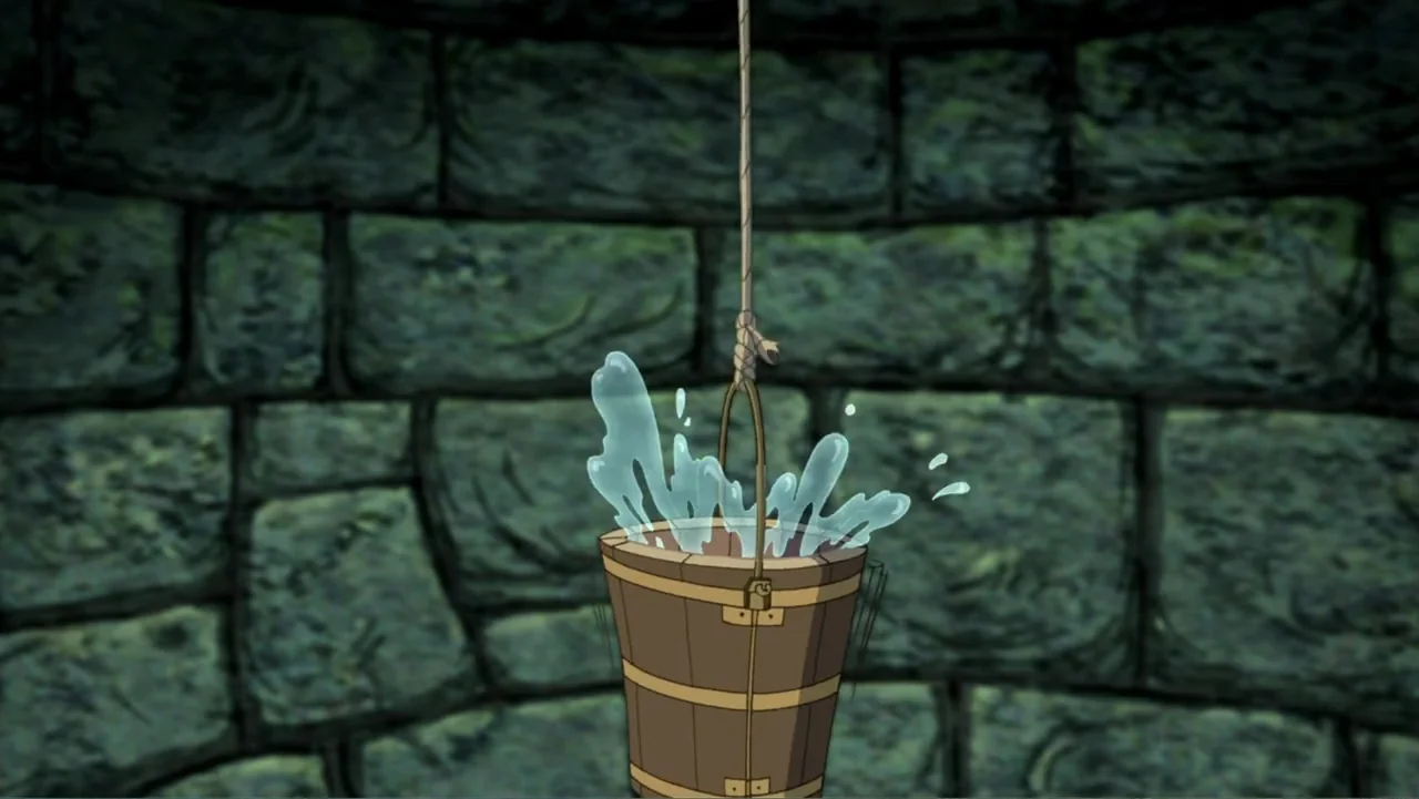 Tom and Jerry & The Wizard of Oz (2011) movie still: medium — A dark stone well interior features curved blocks with mossy mortar lines. A wooden…