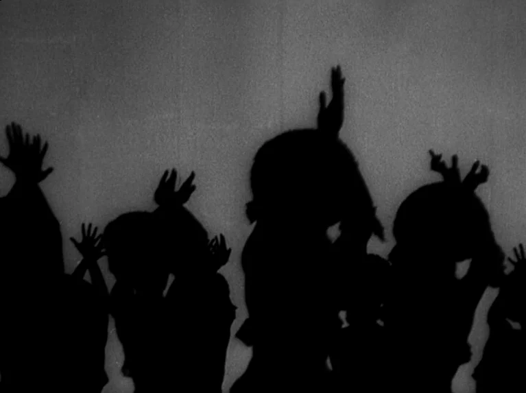 Waiting Women (1952) movie still: medium — Silhouettes of several children stand with arms raised against a flat, bright surface. The figures appear…