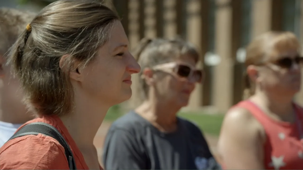 The Day the Music Died: The Story of Don McLean's "American Pie" (2022) movie still: medium — A group of three women stand together outside on a…