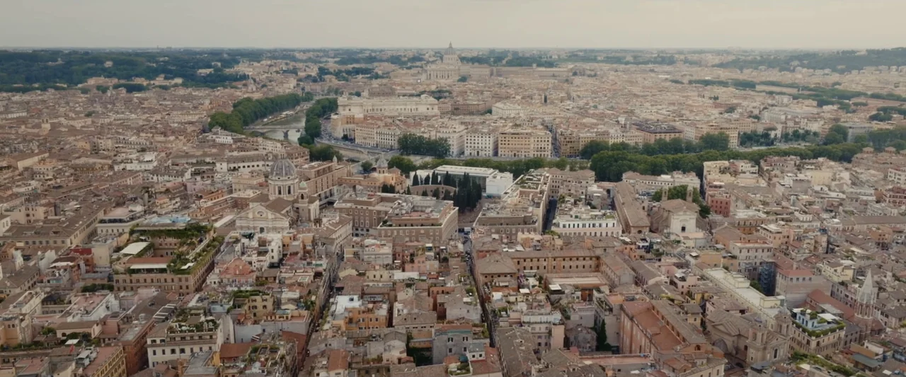 An emperor's jewel - The making of the Bulgari Hotel Roma (2024) movie still: establishing — An aerial view of the historic district of Rome with…