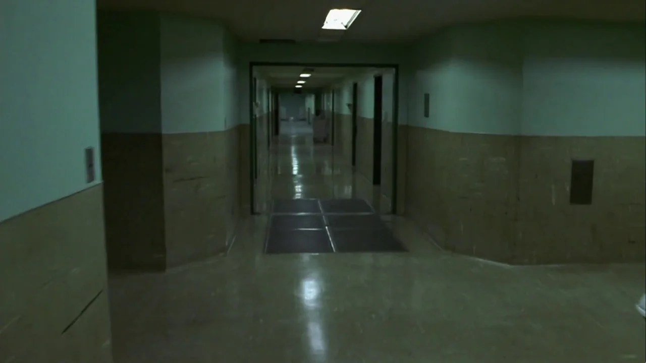 Hellraiser: Inferno (2000) movie still: establishing — A long, symmetrical hospital corridor features walls painted in two-toned mint green and…