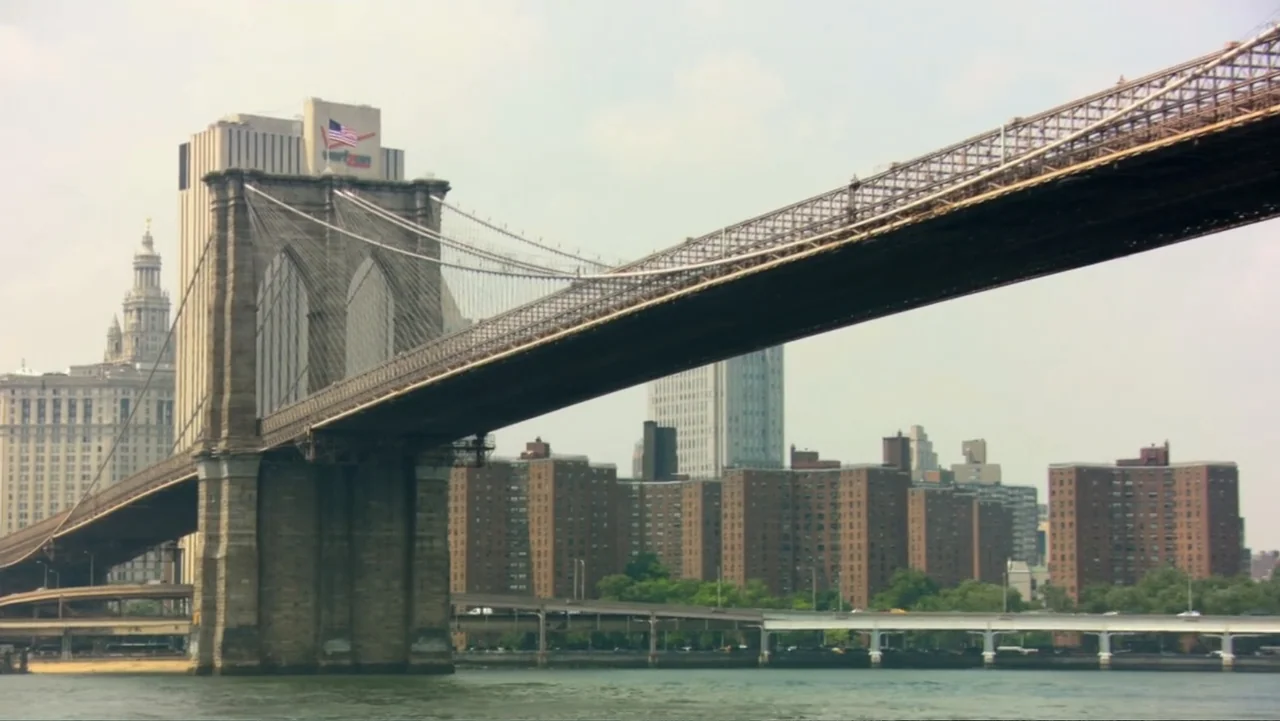 David McCullough: Painting with Words (2008) movie still: wide — The Brooklyn Bridge spans across the East River in a wide, daytime exterior shot.…