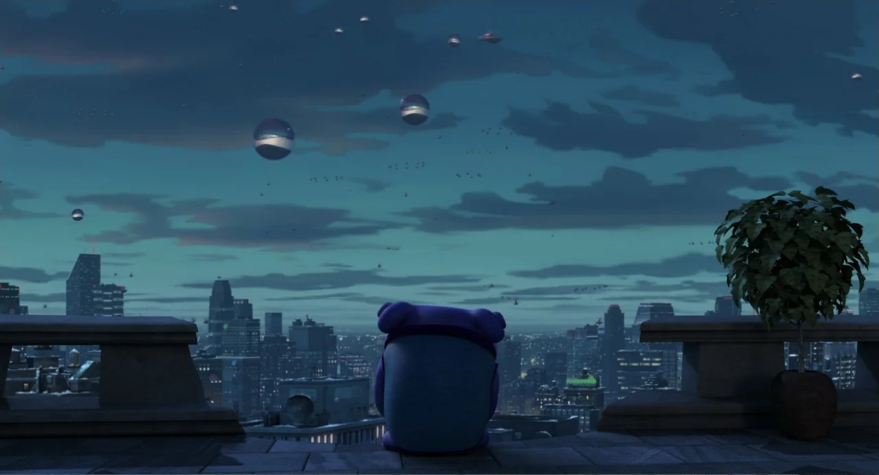 Home (2015) movie still: wide — A concrete rooftop terrace overlooks a sprawling, lit city skyline under a twilight sky. A single small, round,…